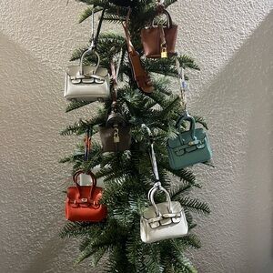 Miniature Women's unbranded bag charms giving H vibes! So cute!